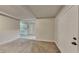 Open living space with kitchen view and carpet flooring at 4129 Shorter Way, Decatur, GA 30034