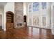 Grand living room with stone fireplace and hardwood floors at 4938 Kanawha Blf, Stone Mountain, GA 30087