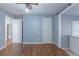 Hardwood floors and light blue walls in spacious bedroom at 1110 1St Nw St, Atlanta, GA 30318