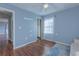 Spacious bedroom with hardwood floors and access to hallway at 1110 1St Nw St, Atlanta, GA 30318