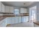 White cabinets, tile floor and stainless steel appliances in kitchen at 1110 1St Nw St, Atlanta, GA 30318
