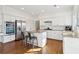 Modern kitchen with stainless steel appliances, granite countertops, and an island at 1302 Calderwood Se Ct, Smyrna, GA 30080