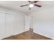 Spacious bedroom with hardwood floors, double doors, and a ceiling fan at 2103 Columbia Dr, Decatur, GA 30032