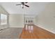 Spacious living room featuring hardwood and carpeted floors, high ceiling, and ceiling fan at 3018 Crest Ridge Sw Cir, Marietta, GA 30060