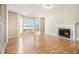 Living room featuring hardwood floors, a fireplace, and a bay window at 3712 Windy Hill Se Dr, Conyers, GA 30013