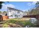 Large backyard with grassy area and wooden fence at 3055 Cooper Woods Ln, Loganville, GA 30052