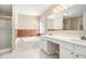 Main bath with double vanity, garden tub, and shower at 3055 Cooper Woods Ln, Loganville, GA 30052