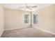 Well-lit bedroom featuring ceiling fan and large windows at 3055 Cooper Woods Ln, Loganville, GA 30052