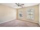 Bright bedroom with ceiling fan and ample natural light at 3055 Cooper Woods Ln, Loganville, GA 30052