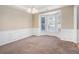 Bright dining room with bay window and wainscoting at 3055 Cooper Woods Ln, Loganville, GA 30052
