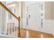 Elegant entryway with hardwood floors and staircase at 3055 Cooper Woods Ln, Loganville, GA 30052