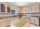 Kitchen with granite countertops and ample cabinetry at 3055 Cooper Woods Ln, Loganville, GA 30052