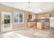 Eat-in kitchen with an island and granite countertops at 3055 Cooper Woods Ln, Loganville, GA 30052