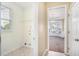 Convenient laundry room with washer/dryer hookups and storage at 3055 Cooper Woods Ln, Loganville, GA 30052