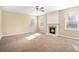 Spacious living room featuring a fireplace and neutral carpeting at 3055 Cooper Woods Ln, Loganville, GA 30052