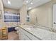 Clean bathroom with granite countertop, toilet, and shower/tub combo at 4522 Karron Ln, Powder Springs, GA 30127