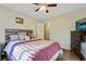 Bedroom with queen bed, dresser, and access to a hallway bathroom at 4522 Karron Ln, Powder Springs, GA 30127