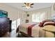 Well-lit bedroom with a queen-size bed and dark wood dresser at 4522 Karron Ln, Powder Springs, GA 30127