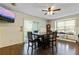 Bright dining room with table and chairs, hardwood floors, and ceiling fan at 4522 Karron Ln, Powder Springs, GA 30127