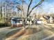 House exterior showcasing landscaping and a tree in the front yard at 4522 Karron Ln, Powder Springs, GA 30127