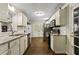Kitchen with granite countertops, stainless steel appliances, and white cabinets at 4522 Karron Ln, Powder Springs, GA 30127