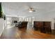 Spacious living room with hardwood floors, fireplace, and bar area at 4522 Karron Ln, Powder Springs, GA 30127