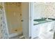 Bathroom with shower and double sinks, green countertop at 95 Brandon Dr, Covington, GA 30016
