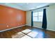 Main bedroom with vaulted ceiling, dark curtains, and wood-look floors at 95 Brandon Dr, Covington, GA 30016