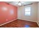 Bedroom with wood-look floors and an accent wall at 95 Brandon Dr, Covington, GA 30016