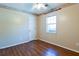 Simple bedroom with wood-look floors and a closet at 95 Brandon Dr, Covington, GA 30016