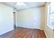Bright bedroom with wood-look floors and a window at 95 Brandon Dr, Covington, GA 30016