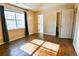 Main bedroom with vaulted ceiling, dark curtains, and wood-look floors at 95 Brandon Dr, Covington, GA 30016
