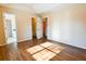Spacious main bedroom with wood-look floors and access to bathroom and closet at 95 Brandon Dr, Covington, GA 30016