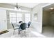Kitchen dining area with glass table and four chairs at 95 Brandon Dr, Covington, GA 30016