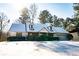 House with snow-covered roof and manicured lawn at 95 Brandon Dr, Covington, GA 30016