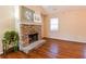 Stone fireplace with a wood mantel in the living room at 95 Brandon Dr, Covington, GA 30016