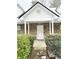 Stone front entryway with white door and landscaping at 95 Brandon Dr, Covington, GA 30016
