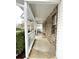 Covered front porch with stone feature wall and white railing at 95 Brandon Dr, Covington, GA 30016