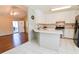 Open kitchen with breakfast bar and view into living room at 95 Brandon Dr, Covington, GA 30016