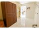 Laundry room with wood cabinet and access to kitchen at 95 Brandon Dr, Covington, GA 30016