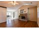 Spacious living room with hardwood floors, stone fireplace, and vaulted ceiling at 95 Brandon Dr, Covington, GA 30016