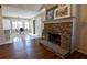 Living room with hardwood floors and a stone fireplace at 95 Brandon Dr, Covington, GA 30016
