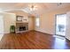 Living room features wood-look floors, stone fireplace, and vaulted ceiling at 95 Brandon Dr, Covington, GA 30016
