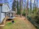 Spacious backyard with screened porch and mature trees at 4611 Eberline Ct, Stone Mountain, GA 30083