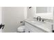 Updated bathroom with white vanity, granite countertop, and modern fixtures at 4611 Eberline Ct, Stone Mountain, GA 30083