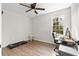 Well-lit bedroom with hardwood floors and a home office setup at 4611 Eberline Ct, Stone Mountain, GA 30083