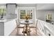 Bright breakfast nook with a round table and chairs, located in the kitchen at 4611 Eberline Ct, Stone Mountain, GA 30083