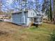 Charming light blue house with a screened porch and deck at 4611 Eberline Ct, Stone Mountain, GA 30083