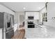 Modern kitchen with white cabinets, granite countertops, and stainless steel appliances at 4611 Eberline Ct, Stone Mountain, GA 30083