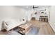 Open concept living room with hardwood floors and views into the kitchen at 4611 Eberline Ct, Stone Mountain, GA 30083